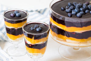 Trifle with banana, mango and wild blueberries