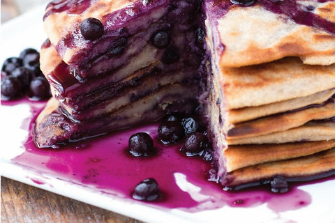 BANANA PANCAKES WITH MAPLE SYRUP AND WILD BLUEBERRIES